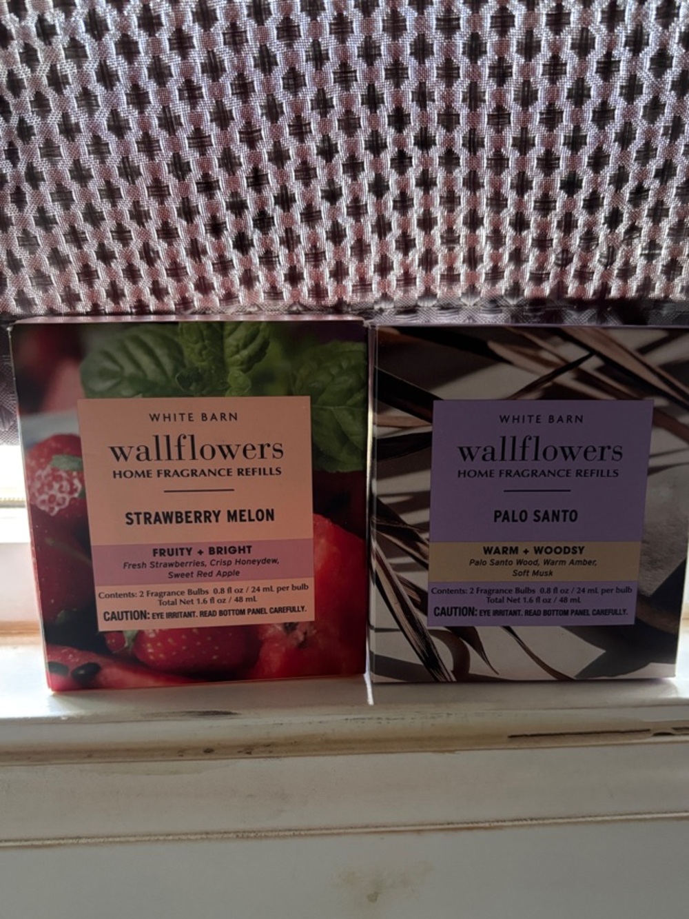 Wallflower refills. Two packs of two. Strawberry Melon and Palo Santo scents